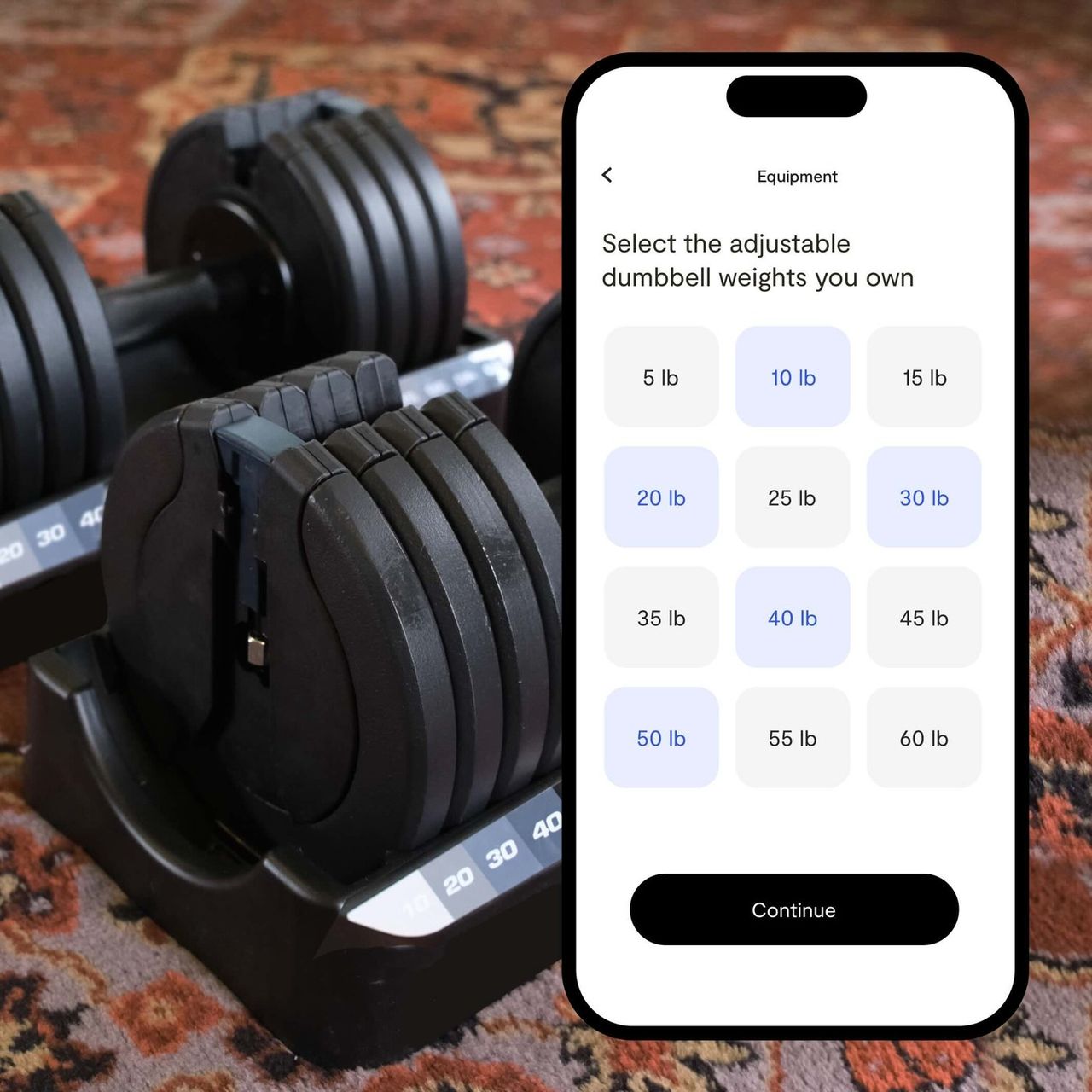 An adjustable dumbbell on a patterned rug beside a phone in Tempo’s app, asking which adjustable dumbbell weights you own, from 5 to 60 lb, with several selected.